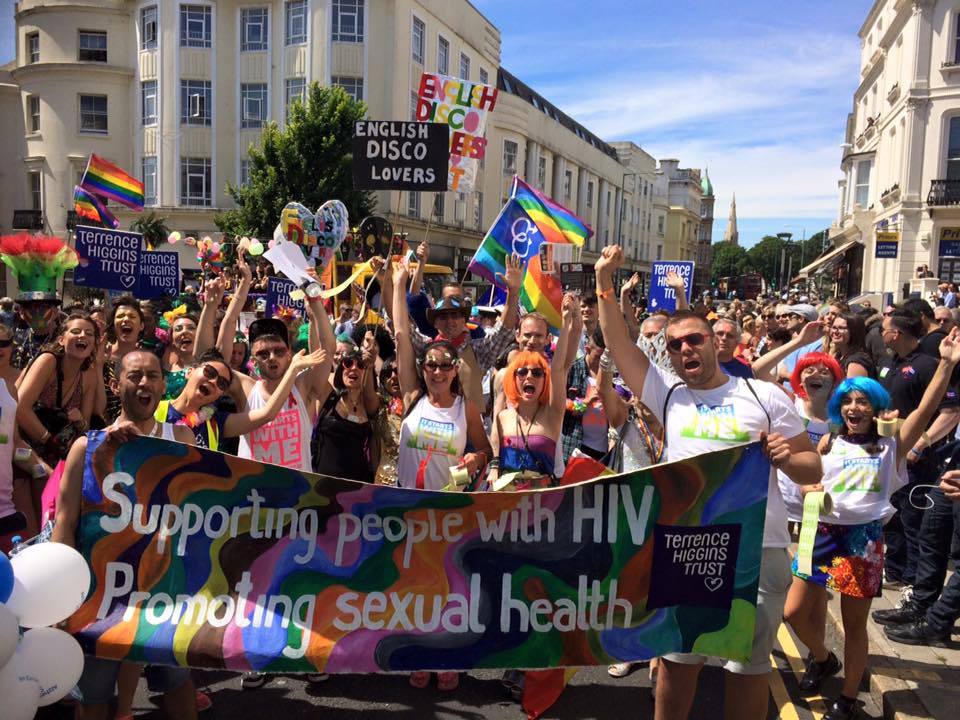 Crowd of people behind banner at Brighton Pride