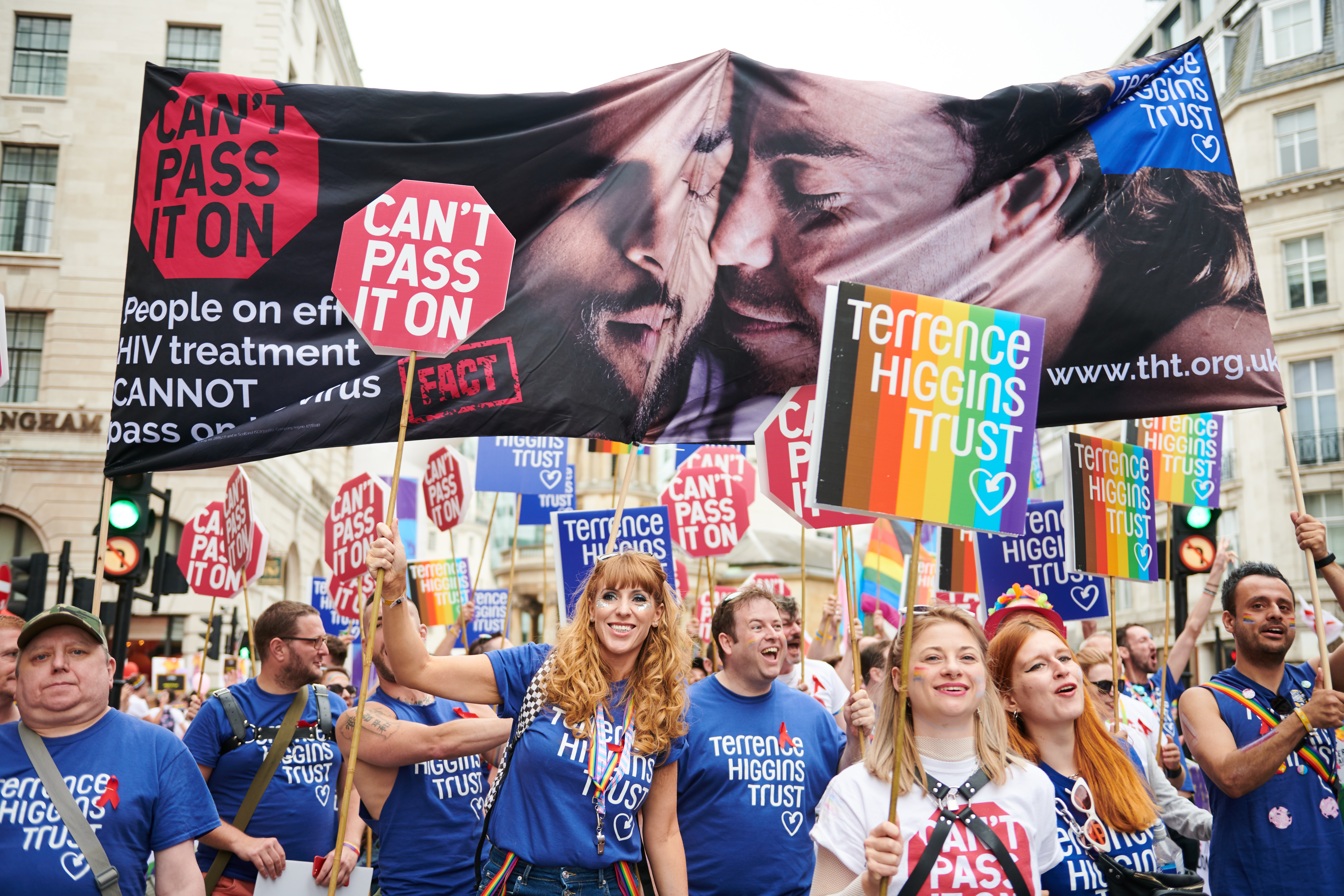 Pride march with Can't Pass It On banners