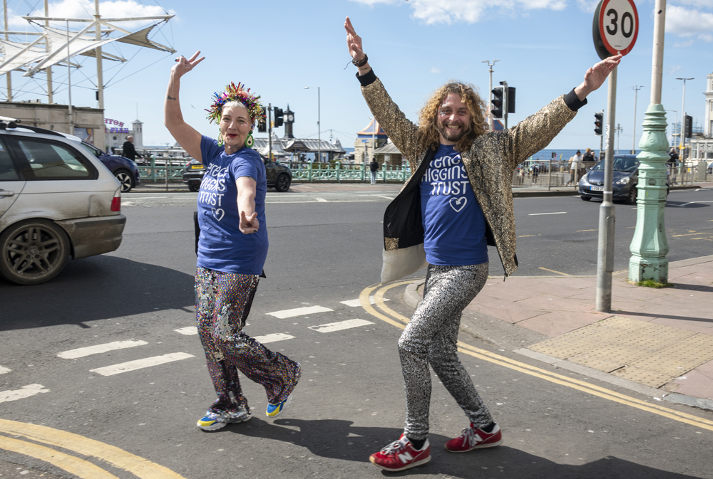 Two people walking in fancy dress and celebrating