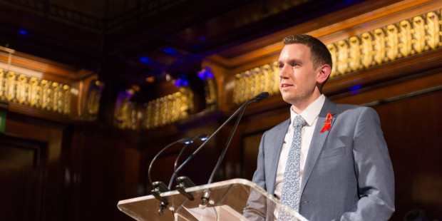 Man making a speech at a lectern